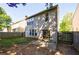 Fenced backyard with lawn and patio area, perfect for outdoor enjoyment at 3226 Saville Sw St, Atlanta, GA 30331