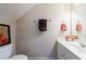 Cozy half bathroom features a modern vanity with framed art, offering comfort and style at 3226 Saville Sw St, Atlanta, GA 30331