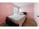 Bedroom features a window for natural light, and a wooden bed frame at 3226 Saville Sw St, Atlanta, GA 30331