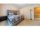 Spacious bedroom featuring a tufted headboard, side tables and ample space at 3226 Saville Sw St, Atlanta, GA 30331
