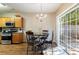 Bright dining area with chandelier lighting and sliding glass door to the backyard at 3226 Saville Sw St, Atlanta, GA 30331