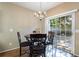 Dining area features a chandelier light fixture and a sliding glass door to the backyard at 3226 Saville Sw St, Atlanta, GA 30331
