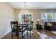 The dining area features a chandelier and sliding glass doors leading to the backyard at 3226 Saville Sw St, Atlanta, GA 30331