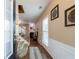 Inviting entryway featuring wood floors, a staircase, and elegant decor at 3226 Saville Sw St, Atlanta, GA 30331