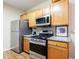 Kitchen features stainless steel appliances and beautiful granite countertops at 3226 Saville Sw St, Atlanta, GA 30331