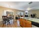 Open-concept kitchen boasts granite countertops, wood cabinets, and stainless steel appliances at 3226 Saville Sw St, Atlanta, GA 30331