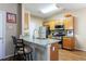 Eat-in kitchen features a breakfast bar with granite counters and stainless steel appliances at 3226 Saville Sw St, Atlanta, GA 30331