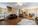 Open-concept living room with a staircase and a combined kitchen and dining area at 3226 Saville Sw St, Atlanta, GA 30331