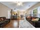 Spacious living room with a combined dining and kitchen area with ample sunlight at 3226 Saville Sw St, Atlanta, GA 30331