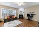 Spacious living room featuring a cozy fireplace and abundant natural light at 3226 Saville Sw St, Atlanta, GA 30331