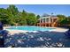 Large community pool with clubhouse and plenty of lounge chairs for relaxing by the water at 3226 Saville Sw St, Atlanta, GA 30331