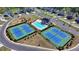 Community aerial view features tennis courts, playground, and pool in a beautifully maintained neighborhood at 5530 Bower Pl, Cumming, GA 30028