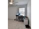 Bedroom with light wood floors featuring neutral walls, fan, and windows providing lots of natural light at 5530 Bower Pl, Cumming, GA 30028