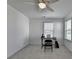 Bright room featuring neutral walls, carpet, fan, and windows providing lots of natural light at 5530 Bower Pl, Cumming, GA 30028