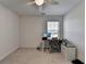 Bedroom with light wood floors featuring neutral walls, fan, and windows providing lots of natural light at 5530 Bower Pl, Cumming, GA 30028