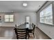 Bright dining room featuring a large table with seating for six, and natural light at 5530 Bower Pl, Cumming, GA 30028