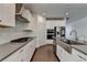 Well-equipped kitchen with stainless steel appliances and stylish white cabinetry at 5530 Bower Pl, Cumming, GA 30028