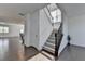 Bright, open floor plan with hardwood floors, staircase, and ample natural light throughout the home at 5530 Bower Pl, Cumming, GA 30028