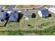 Aerial view of the home's rear exterior and spacious backyard at 5530 Bower Pl, Cumming, GA 30028