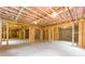 Large unfinished basement with exposed wooden framing, ready for future customization at 7636 Chestnut Hill Rd, Cumming, GA 30041