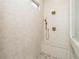 Modern tiled shower with bench, rainfall shower head and glass surround at 7636 Chestnut Hill Rd, Cumming, GA 30041