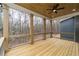 Outdoor deck with cable railings, wood ceiling, and view of wooded area at 7636 Chestnut Hill Rd, Cumming, GA 30041