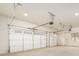 Spacious three-car garage with white doors and ample lighting at 7636 Chestnut Hill Rd, Cumming, GA 30041
