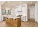 Bright kitchen featuring stainless appliances, a wood island and ample storage space at 7636 Chestnut Hill Rd, Cumming, GA 30041