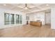 Open-concept living area with access to a screened porch, showcasing a bright and airy kitchen at 7636 Chestnut Hill Rd, Cumming, GA 30041