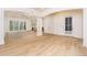 Bright living room featuring hardwood floors, recessed lighting, and expansive windows at 7636 Chestnut Hill Rd, Cumming, GA 30041
