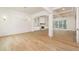 Spacious living room with hardwood floors, elegant lighting, and a cozy fireplace at 7636 Chestnut Hill Rd, Cumming, GA 30041