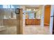Bathroom with tiled floors, glass shower and large double vanity at 223 Cheatham Rd, Acworth, GA 30101