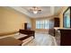 Spacious bedroom features tray ceilings, wood floors, and a ceiling fan at 223 Cheatham Rd, Acworth, GA 30101