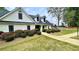 Community clubhouse with trimmed landscaping, tennis courts and a playground in the background at 223 Cheatham Rd, Acworth, GA 30101