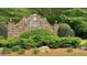 Stone community sign for Wesley Heights surrounded by lush landscaping and mature trees at 223 Cheatham Rd, Acworth, GA 30101