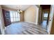 Spacious dining area featuring hardwood floors, natural light, and a view of the hall at 223 Cheatham Rd, Acworth, GA 30101