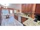 Kitchen showcasing granite countertops, stainless appliances, and rich wood cabinetry at 223 Cheatham Rd, Acworth, GA 30101
