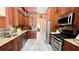 Gorgeous kitchen features stainless steel appliances, granite countertops, and wood cabinets at 223 Cheatham Rd, Acworth, GA 30101