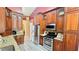 This kitchen features stainless steel appliances, granite countertops, and wooden cabinets at 223 Cheatham Rd, Acworth, GA 30101