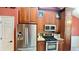 Stylish kitchen featuring stainless steel appliances, granite countertops, and dark wood cabinetry at 223 Cheatham Rd, Acworth, GA 30101