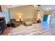 Comfortable living area featuring hardwood floors, a fireplace, and bright natural light at 223 Cheatham Rd, Acworth, GA 30101