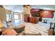Spacious open-concept living room with wood floors, brick fireplace, and adjoined dining area at 223 Cheatham Rd, Acworth, GA 30101