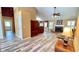 Open concept living room featuring a fireplace, hardwood floors, and views of the bathroom and backyard at 223 Cheatham Rd, Acworth, GA 30101