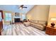 Spacious living room with vaulted ceilings, fireplace, and new flooring at 223 Cheatham Rd, Acworth, GA 30101
