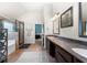 Bathroom featuring a glass shower, separate bathtub and a double sink at 2745 Veltre Sw Ter, Atlanta, GA 30311