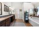 Bright bathroom boasting dual sinks, vanity space, and a separate tub at 2745 Veltre Sw Ter, Atlanta, GA 30311