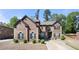 Charming brick home with manicured landscaping and symmetrical design elements, offering classic curb appeal and timeless elegance at 2745 Veltre Sw Ter, Atlanta, GA 30311