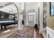 Elegant foyer featuring soaring ceilings, hardwood floors, and direct access to dining and recreational rooms, ideal for entertaining at 2745 Veltre Sw Ter, Atlanta, GA 30311