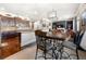 Open-concept kitchen with island, breakfast area, dark wood cabinets and seamlessly flowing to the living space at 2745 Veltre Sw Ter, Atlanta, GA 30311