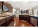 Beautiful kitchen featuring dark wood cabinets, granite countertops, and stainless steel appliances at 2745 Veltre Sw Ter, Atlanta, GA 30311